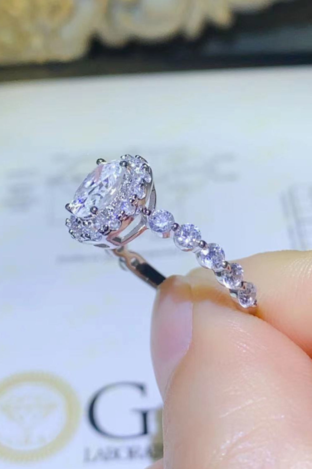 Adored 1 Carat Oval-Cut Sparkala™ Platinum Over Pure Sterling Silver Halo Ring by Sparkala