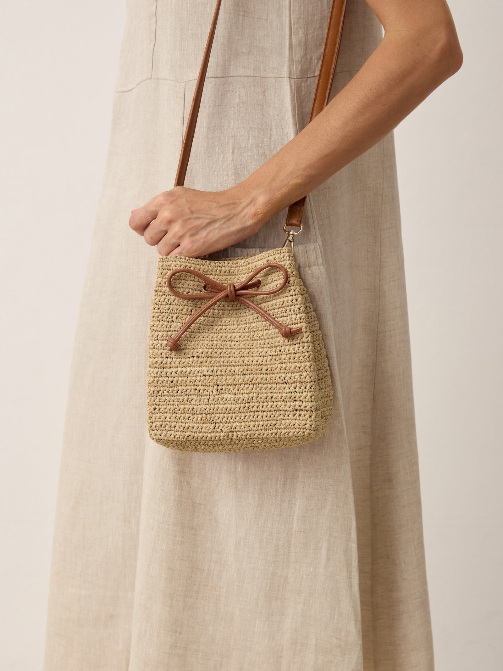 Mini Handwoven Raffia Drawstring Crossbody Bag by LINTICO