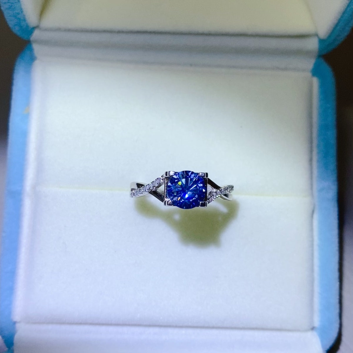 1 Carat Blue Brilliant Round Cut Sparkala™ Crisscross Pure Sterling Silver Ring by Sparkala