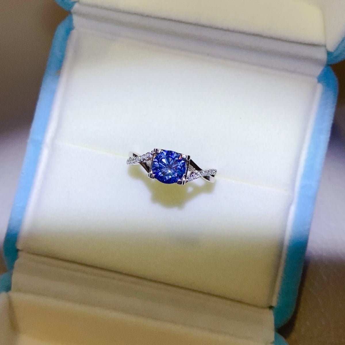 1 Carat Blue Brilliant Round Cut Sparkala™ Crisscross Pure Sterling Silver Ring by Sparkala