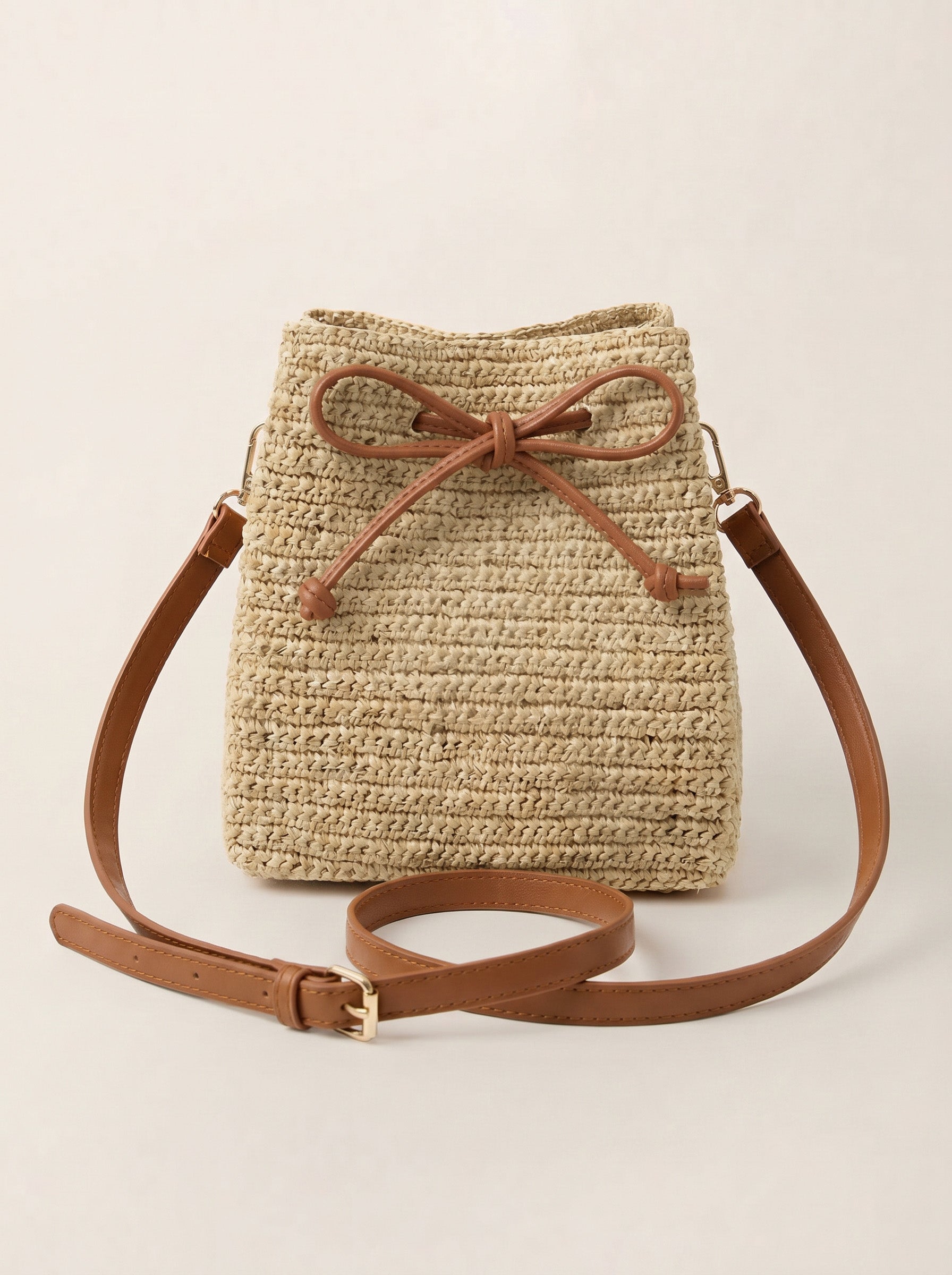 Mini Handwoven Raffia Drawstring Crossbody Bag by LINTICO