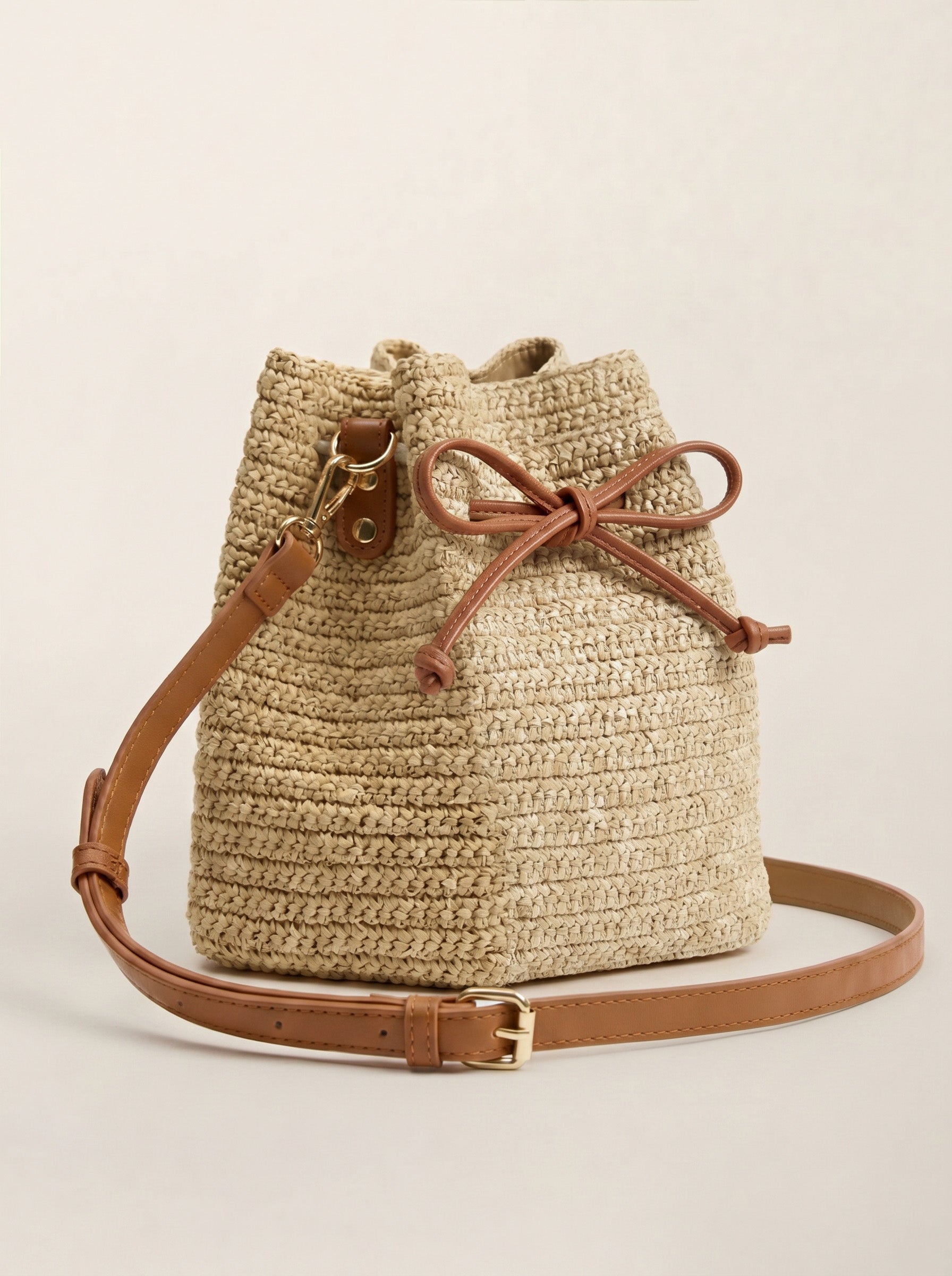 Mini Handwoven Raffia Drawstring Crossbody Bag by LINTICO