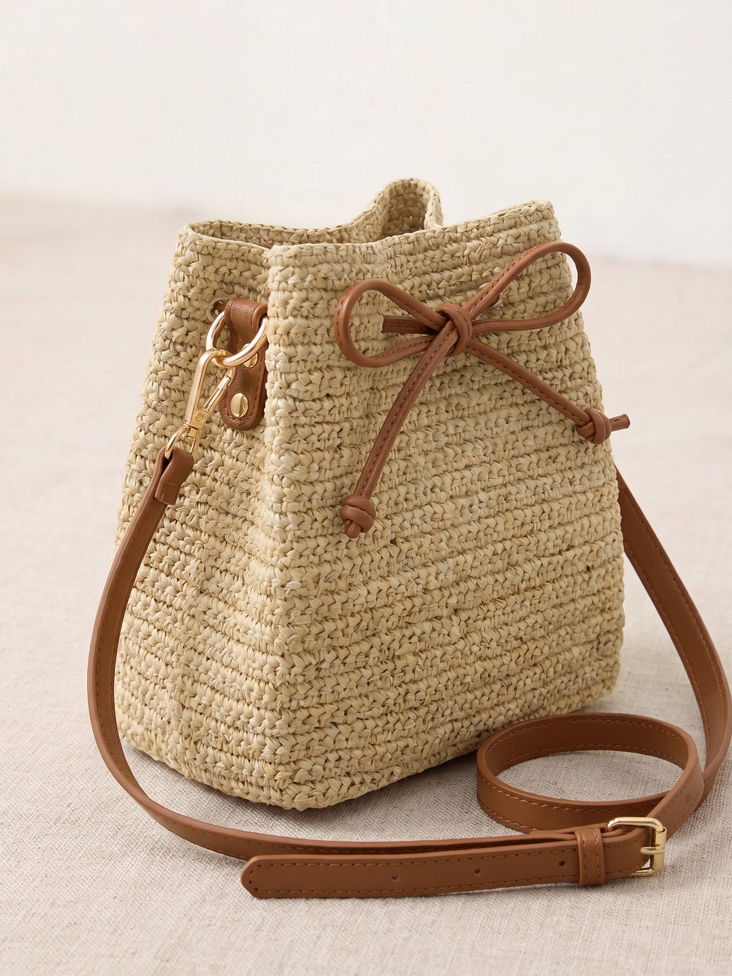 Mini Handwoven Raffia Drawstring Crossbody Bag by LINTICO