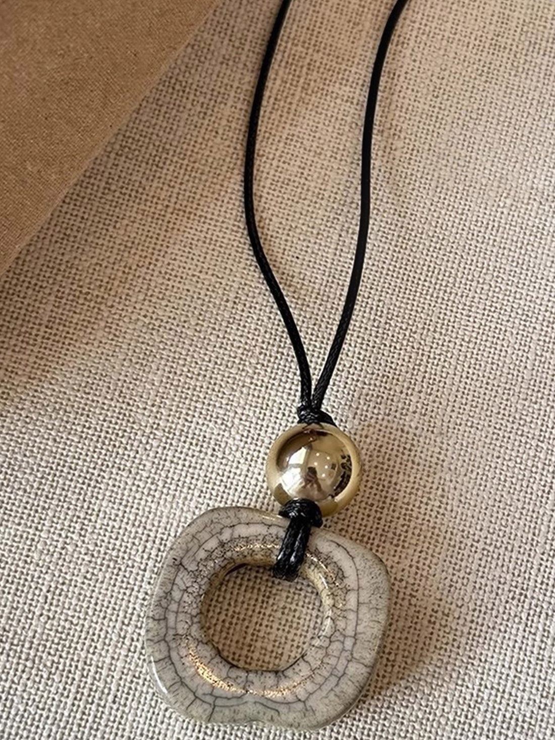 Long Sweater Necklace With Resin Camel Bone Pendant by LINTICO