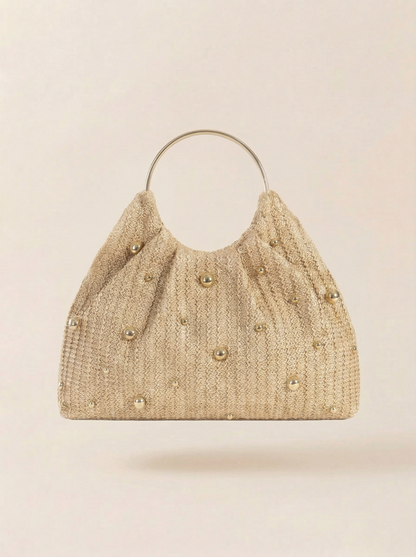 Artisanal Studded Handwoven Raffia Bag with Sculptural Gold Ring Handle by LINTICO