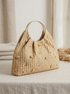 Artisanal Studded Handwoven Raffia Bag with Sculptural Gold Ring Handle by LINTICO