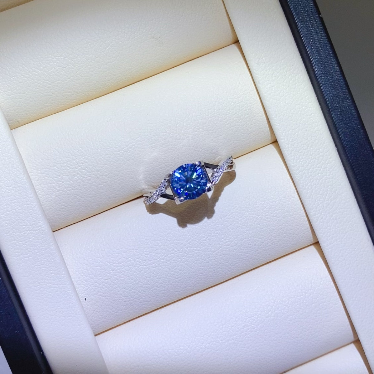 1 Carat Blue Brilliant Round Cut Sparkala™ Crisscross Pure Sterling Silver Ring by Sparkala
