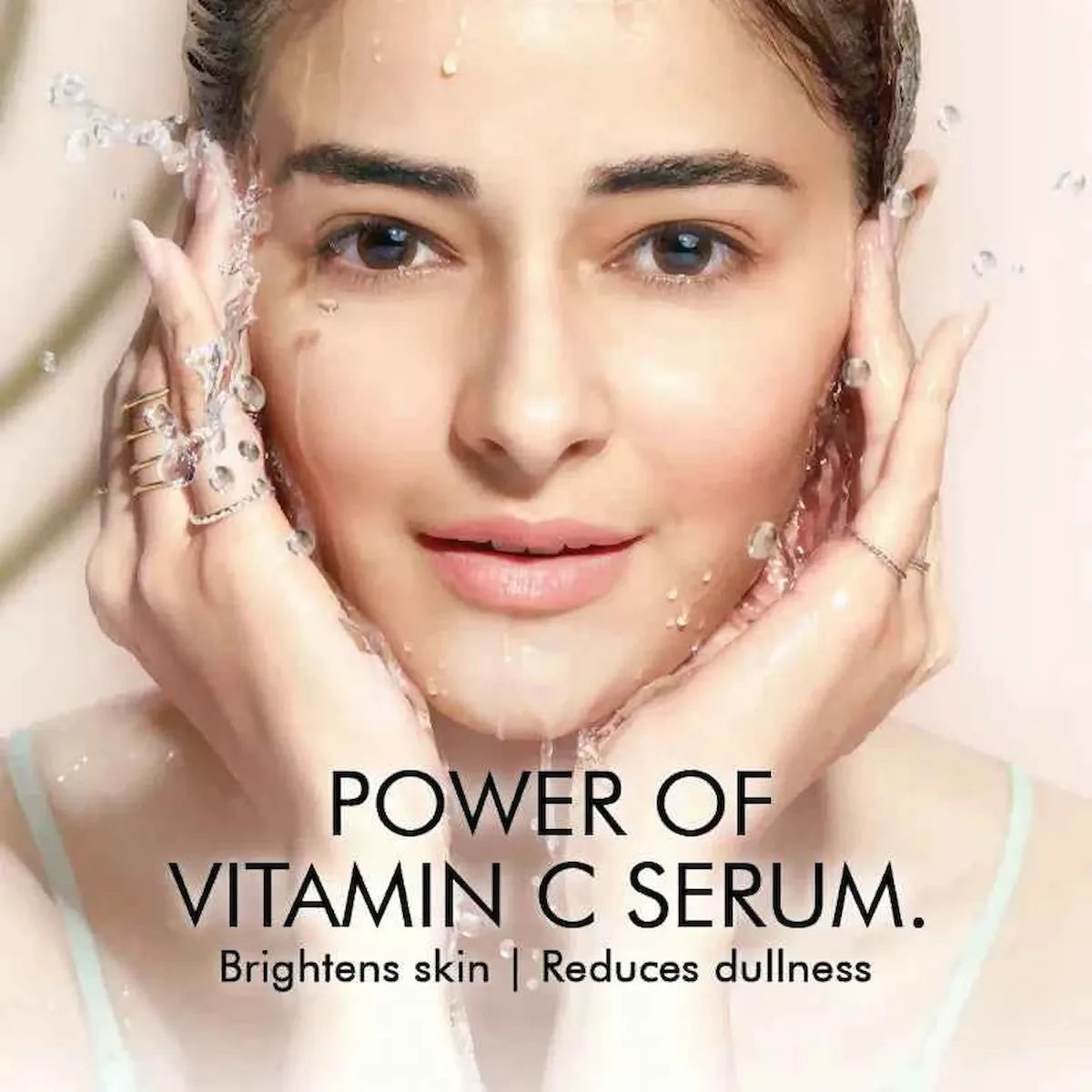 Woman applying a vitamin C serum with text highlighting its benefits